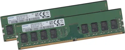 Two green RAM modules are shown diagonally against a white background.