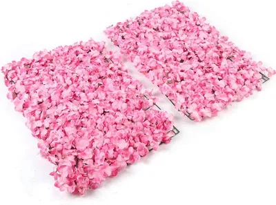 Two panels of artificial pink flowers are laid out on a white background.