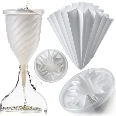 A set of wine filtering equipment, including a funnel, filter papers, and filter holders, arranged on a white background.