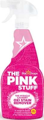 A pink spray bottle of laundry stain remover against a white background.