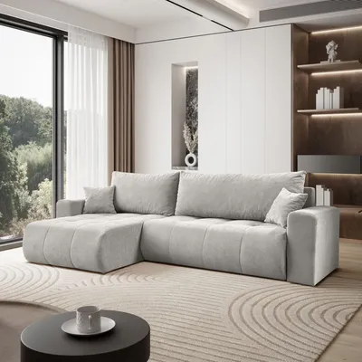 A modern living room with a light gray sectional sofa.