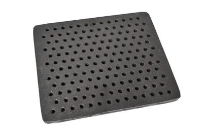 A square cast iron grate with many small holes, shown from a slightly elevated angle against a white background.