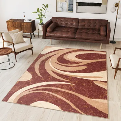A living room scene with a sofa, armchair, side table, and a rug.