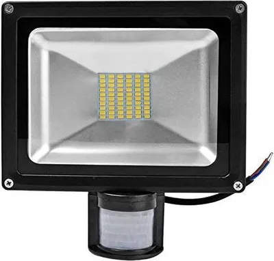 A black LED floodlight with a motion sensor attached to the bottom, set against a white background.