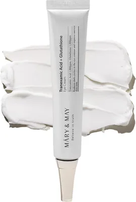 A tube of eye cream is shown against a white background with swatches of cream.