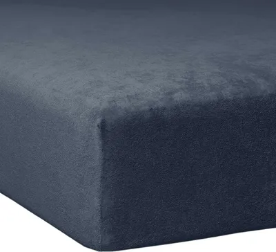 A close-up, angled view of a navy blue fitted sheet, showing its textured fabric and corner.
