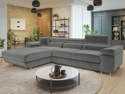 A modern living room with a large sectional sofa, coffee table, and decorative elements.