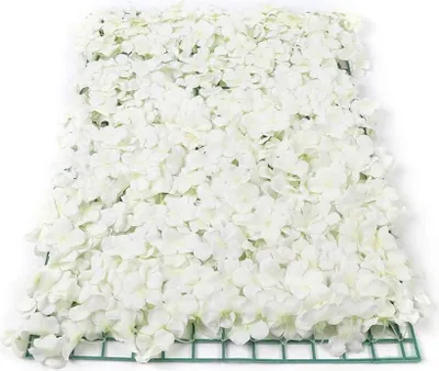 A close-up view of a white artificial flower wall panel.