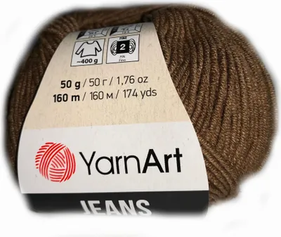 A ball of brown yarn with a label attached.