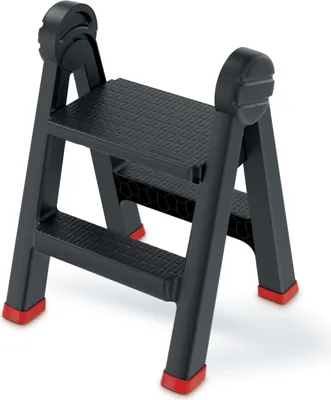 A black folding step stool with red feet on a white background.