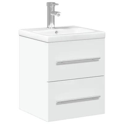 A white bathroom vanity with a sink and faucet.