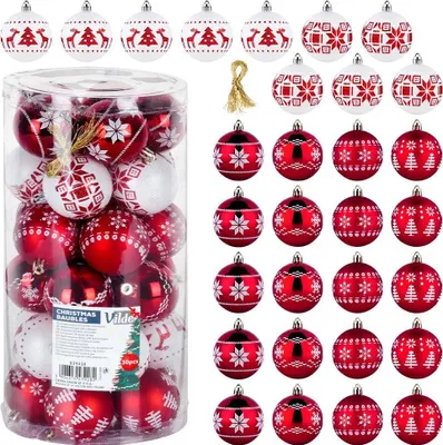 A collection of red and white Christmas baubles in a clear plastic container and arranged around it.