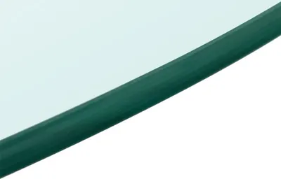 A close-up view of the edge of a round glass tabletop with a green edge.