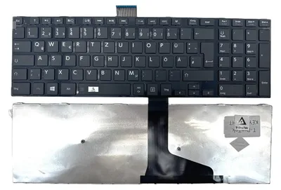 A laptop keyboard and its palm rest are shown against a white background.