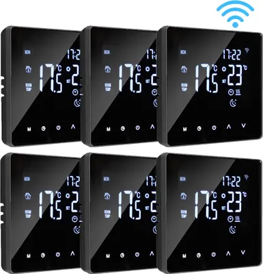A set of six smart thermostats arranged in two rows of three.