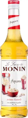 A bottle of Monin Popcorn syrup against a white background.