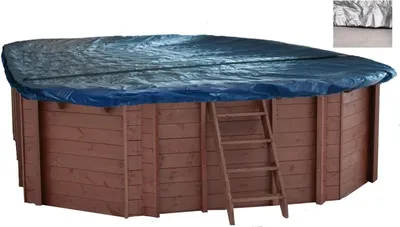 An oval wooden pool with a blue cover and a ladder.