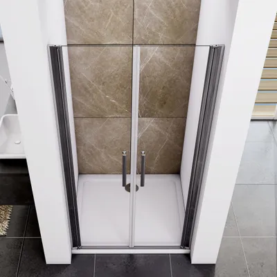 A shower enclosure with glass doors and a white shower tray, set against a tiled wall.