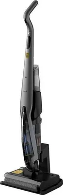 A vacuum cleaner is shown standing upright on its charging base.