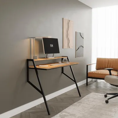 A modern home office setup with a wall-mounted desk and computer.