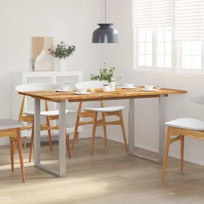 A dining table and chairs set up in a dining room.