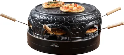 A black pizza oven with wooden handles and two small pizzas on top and two inside.