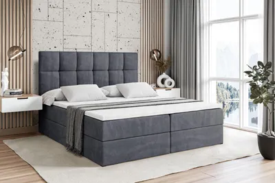 A bedroom scene with a large bed, nightstands, and a window with a view.