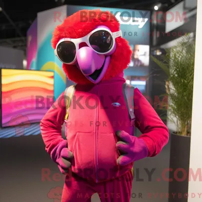 Produktbild von Maskottchen REDBROKOLY eines magentafarbenen Papageis mit Jogginghose und Sonnenbrille
