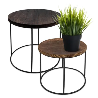 Two nesting tables with dark wood tops and black metal frames, one with a potted plant.