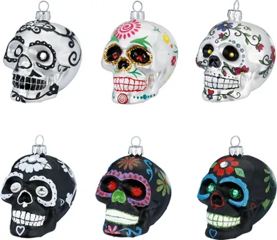 Six glass skull ornaments are displayed against a white background.