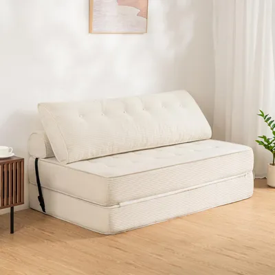 A white convertible sofa bed is shown in a room with a wooden floor and a white wall.