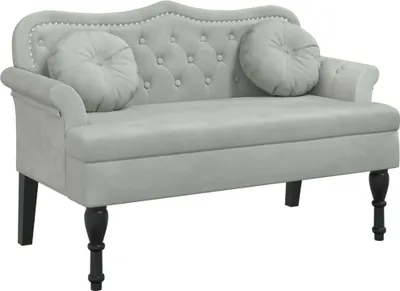 A light gray velvet bench with two round cushions and black legs, shown against a white background.