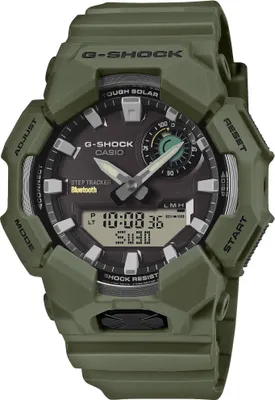 A close-up studio shot of a green G-Shock watch.