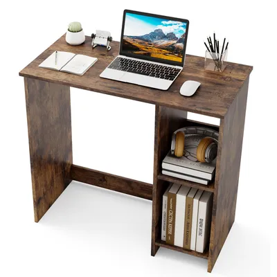 A wooden desk with a laptop, notebook, and other office supplies.
