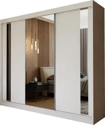 A white sliding door wardrobe with mirrored doors, reflecting a bedroom interior with a bed and bedside table.