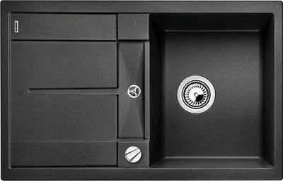 A top-down view of a black granite kitchen sink with a drainer and a main basin.