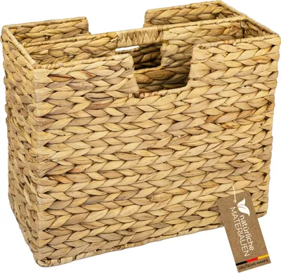 A woven basket with two compartments, displayed against a white background.