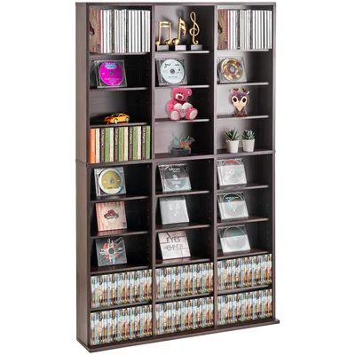 A dark brown, multi-shelf media storage unit filled with CDs, DVDs, and decorative items.