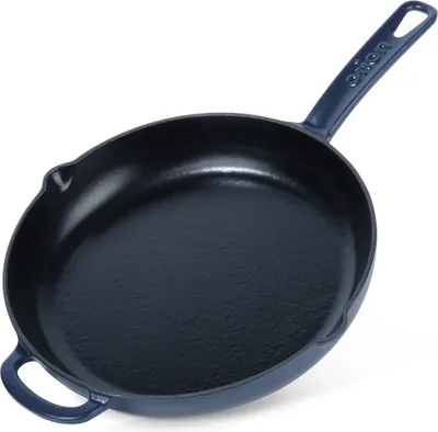 A dark blue cast iron skillet with a handle and two small helper handles on the sides, shown against a white background.