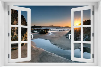 Produktbild von Wallario Poster mit Fenster-Illusion: Sonnenuntergang hinter einem Felsen am Strand, Größe: 61 x 91,5 cm (Maxiposter)