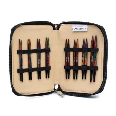 An open knitting needle case showing sets of knitting needles.