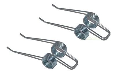 Three metal springs are arranged diagonally on a white background.