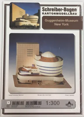 The image shows the packaging of a cardboard model kit of the Guggenheim Museum in New York.