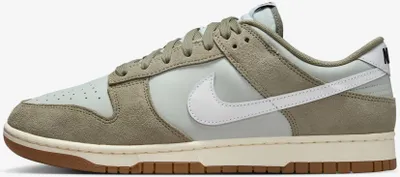 A side view of a Nike Dunk Low Retro SE sneaker.