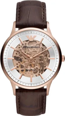 A close-up, front-facing studio shot of an Emporio Armani Meccanico watch with a brown leather strap and a rose gold case.