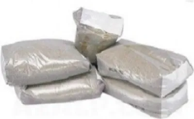 Several bags of sand filter media are stacked together on a white background.