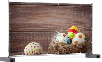 Produktbild von Wallario XXL Outdoor-Poster für Garten oder Balkon, Motiv Bunte bemalte Eier an Ostern im Vorgelnest vor hölzerner Wand, in ca. 340 x 173 cm