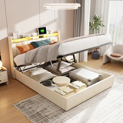 A bedroom scene with a bed that has its storage compartment open, revealing items inside.