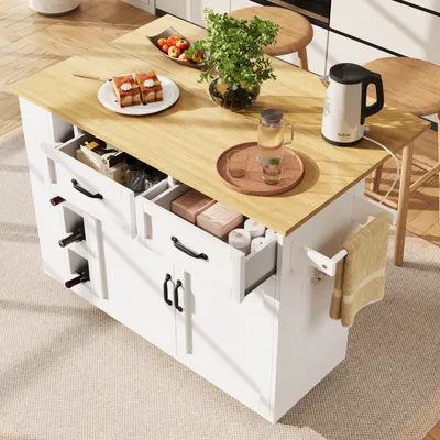 A kitchen island with food and drinks on top, set in a kitchen environment.