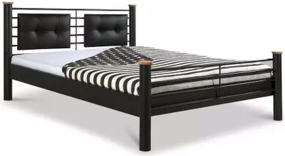 A black metal bed frame with a striped duvet and two black headboard cushions.